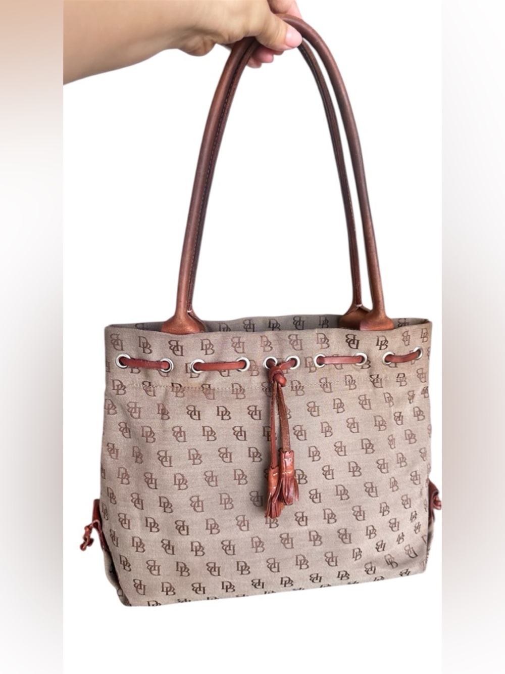 Dooney & Bourke monogram canvas and leather drawstring tote bag. - Picture 2 of 11